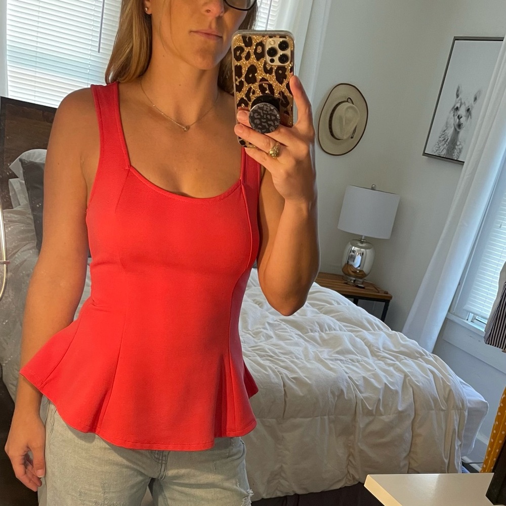 Fitted coral peplum top